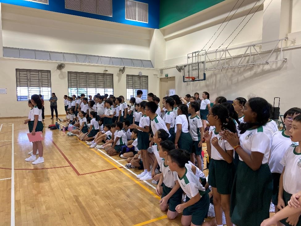 Rooting and cheering on their classmates to play their best